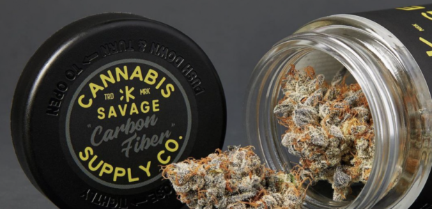 High-quality CBD flower bud shown with its original packaging, featuring a black 'Savage Carbon Fiber' lid and glass jar